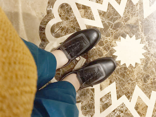 Ain City shoes paired with professional travel outfit