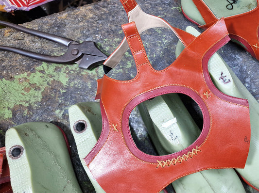 Handcrafted leather shoe with artisan tools at Rana Cheikha workshop